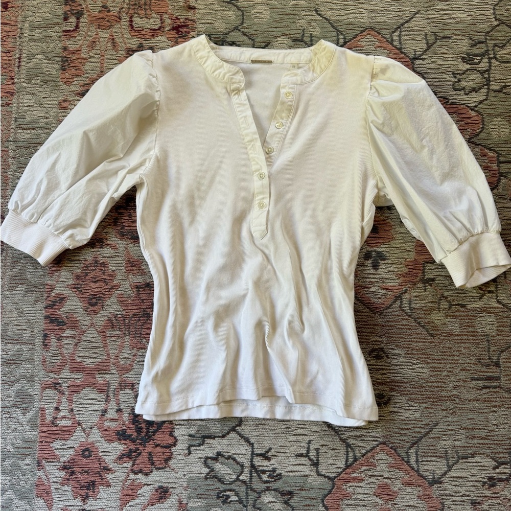 White puffy sleeved blouse.